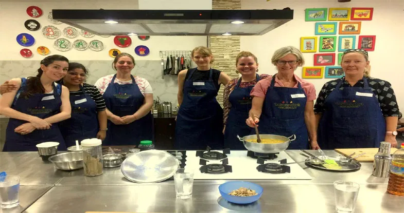 Group of tourists having cooking Class, Gujarat Image