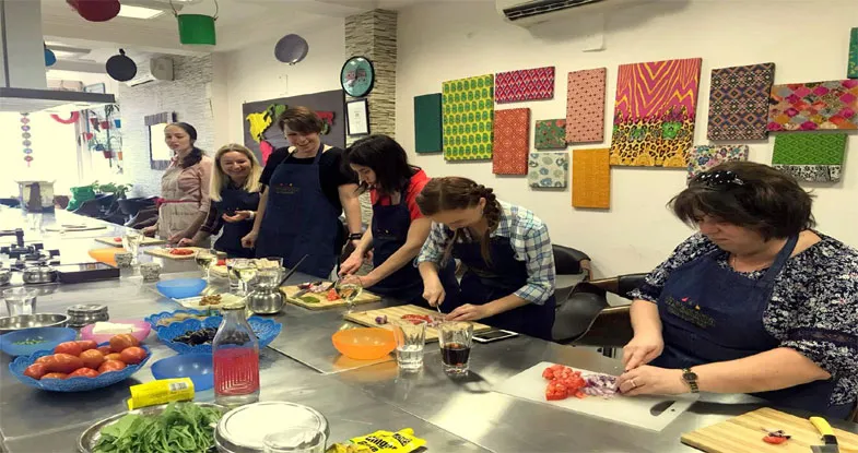 Group of tourists having cooking Class, Gujarat Image