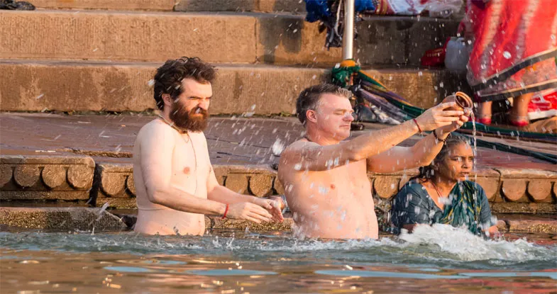 Tourists worshiping at ghats of Varanasi Image